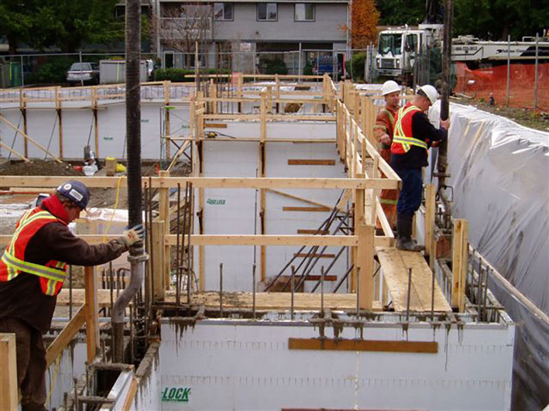 Quad-Lock & Quad-Deck ICF Condominium and Retail development in Qualicum, BC - zero clearance construction of walls - Green Harbor Building Systems GA